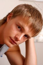 Blond-haired guy showing his armpits and muscular arms