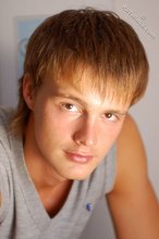 Blond-haired guy showing his armpits and muscular arms