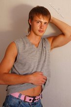 Blond-haired guy showing his armpits and muscular arms