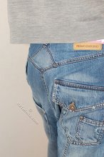 Blond-haired guy showing his armpits and muscular arms