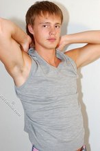 Blond-haired guy showing his armpits and muscular arms