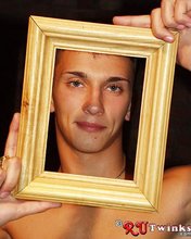 Horny guy posing with a picture frame, totally fucking naked