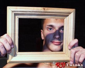 Horny guy posing with a picture frame, totally fucking naked