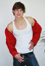 Guy with longish hair flashing his amazing abs on camera