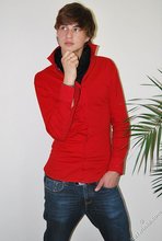 Long-haired twink in red slowly undressing in front of the cam