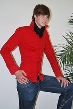 Long-haired twink in red slowly undressing in front of the cam