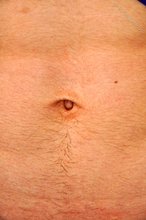 Sexy twink with an extremely muscular body shows his ass as well