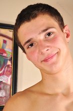Sexy twink with an extremely muscular body shows his ass as well