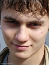 Dark-haired Russian twink invitingly showing off his ass