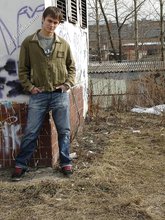 Dark-haired Russian twink invitingly showing off his ass