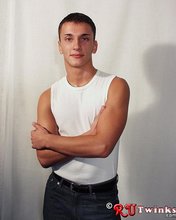 Good-looking guy with a girly-looking face shows his abs