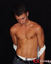 Good-looking guy with a girly-looking face shows his abs