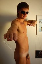 Naked guy puts on his shades to strike a few very sexy poses