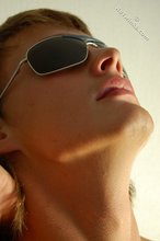 Naked guy puts on his shades to strike a few very sexy poses