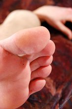 Pale young boy shows his sexy toes and his uncut dick as well