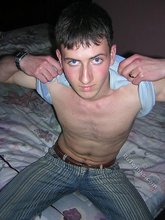 Young twink showing his soles and toes in the dark while stripping