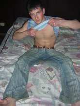 Young twink showing his soles and toes in the dark while stripping