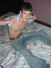 Young twink showing his soles and toes in the dark while stripping