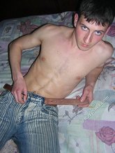 Young twink showing his soles and toes in the dark while stripping