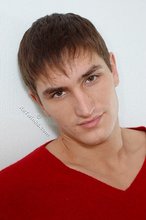 Dark-haired guy dressed in red teases his nips thru the sweater
