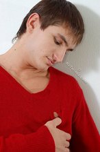 Dark-haired guy dressed in red teases his nips thru the sweater