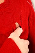 Dark-haired guy dressed in red teases his nips thru the sweater