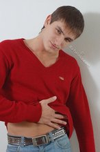 Dark-haired guy dressed in red teases his nips thru the sweater