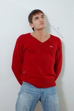 Dark-haired guy dressed in red teases his nips thru the sweater