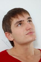 Dark-haired guy dressed in red teases his nips thru the sweater