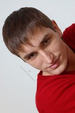 Dark-haired guy dressed in red teases his nips thru the sweater