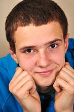 Dark-haired guy with an honest smile shows his tight ass
