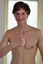 Young beauty showing off his cum-soaked pubes up close