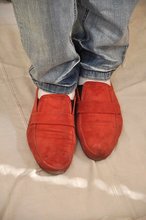 Dark-haired guy shows off his cock and sexy feet on camera