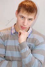 Young boy in red briefs showing his perfect abs on camera