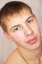 Young boy in red briefs showing his perfect abs on camera