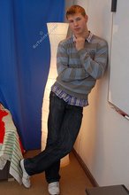 Young boy in red briefs showing his perfect abs on camera