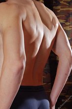 Slim dude with amazing abs showing off his feet and toes as well