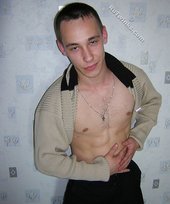 Black pants twink boy is posing indoors and outdoors