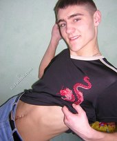 Twink hugs a wall and takes off his shirt