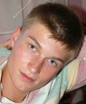 Blue-eyed blonde beauty takes off his striped shirt