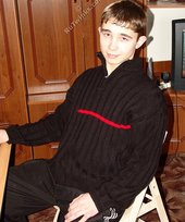 Dark-haired twink posing shirtless in his own room