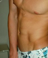 Blond-haired twink showing off his sexy abs on cam