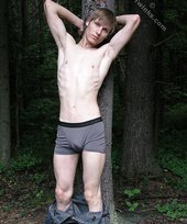 Blond-haired hottie gets naked in the forest