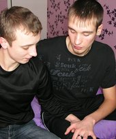 Two luxurious gay boys posing together on a bed