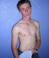 Green-eyed red-faced twink takes off his shirt