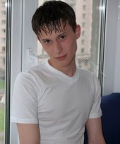 Teen guy showing off his asshole next to a window