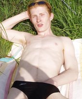Redheaded twink exposes his creamy ass outdoors
