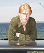 Redheaded twink shows his feet and his sexy body