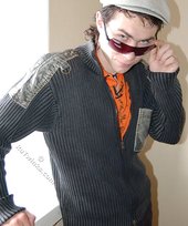 Shades-wearing twink posing seductively on camera