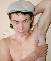 Curly-haired young boy wearing the sluttiest thong